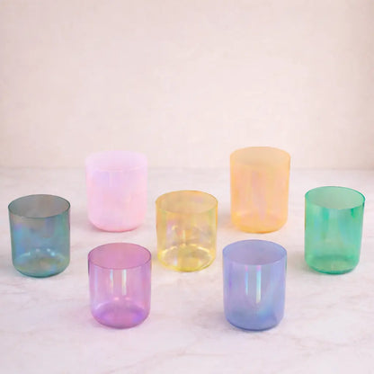 Set of iridescent glass tumblers on a light background
